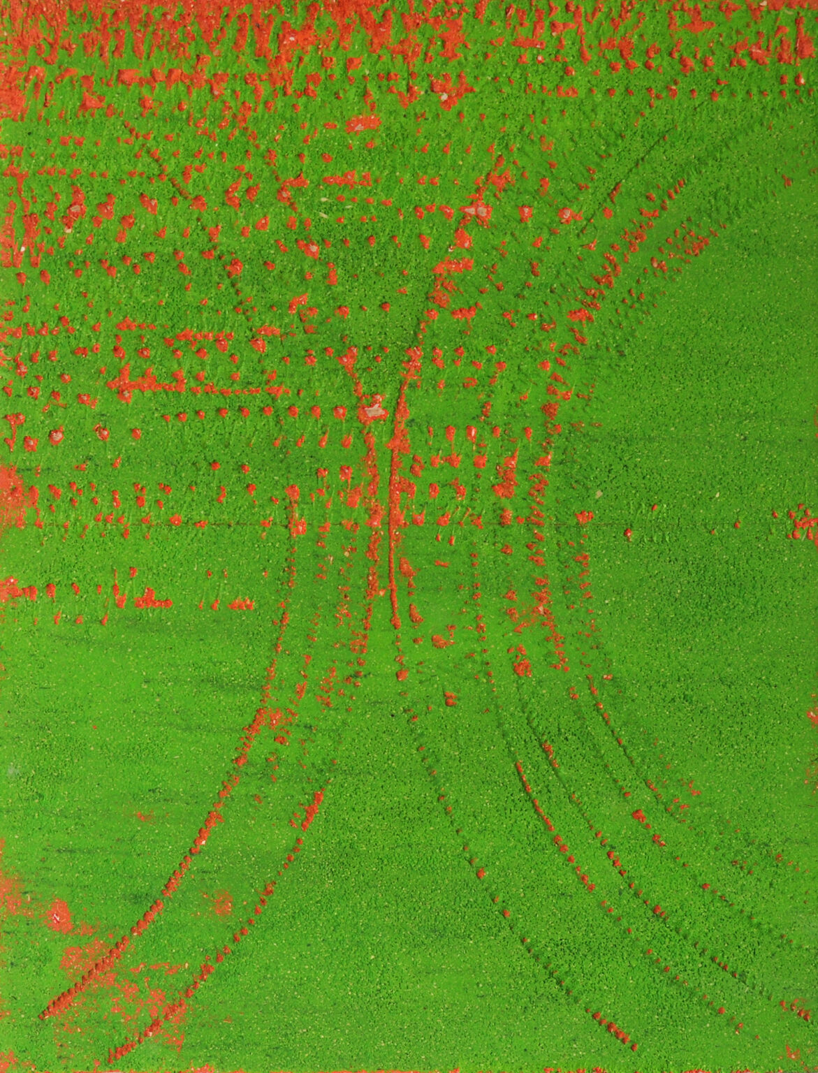 Obraz stworzony z zielonego koloru. Pod spodem przebija się barwa czerwona.