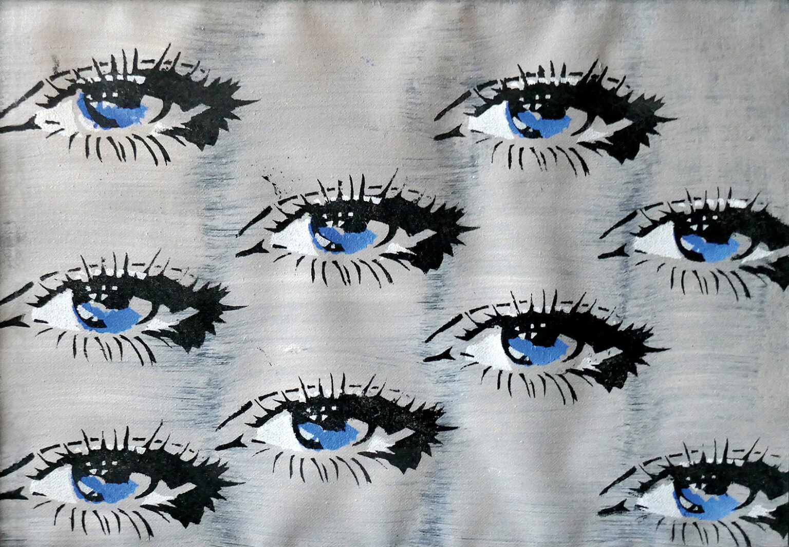 szara tkanina z nadrukowanymi oczami w niebieskim kolorze