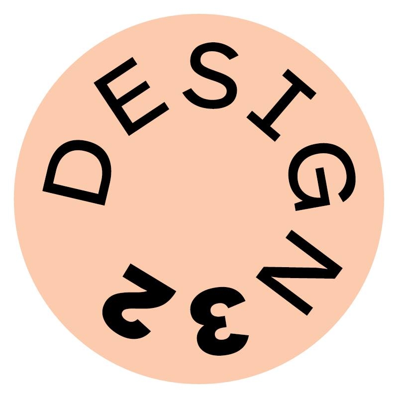 Koło w kolorze brzoskwiniowym z napisem "DESIG 32"